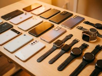 Pre-owned mobile phones and smart watches on display